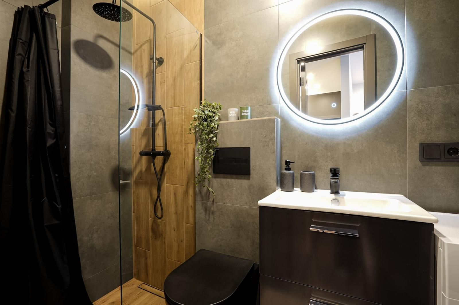 Modern bathroom with LED circular mirror