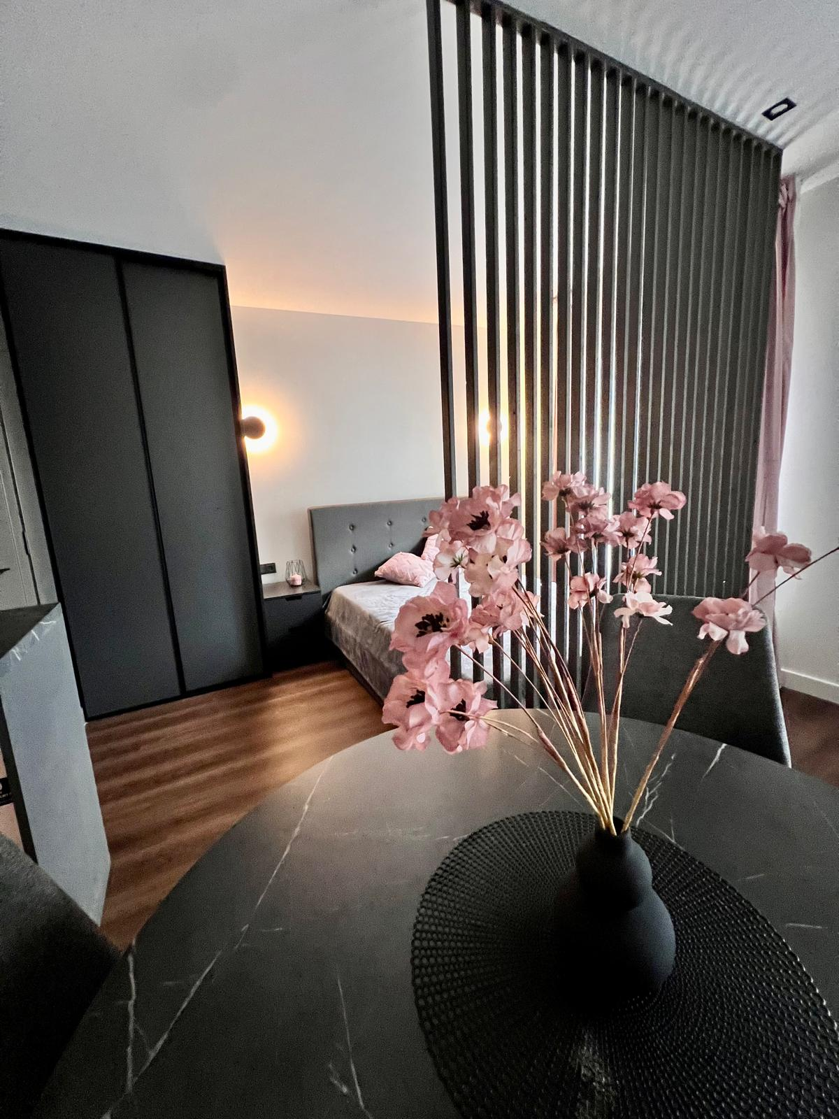 Modern bedroom with vertical slat divider