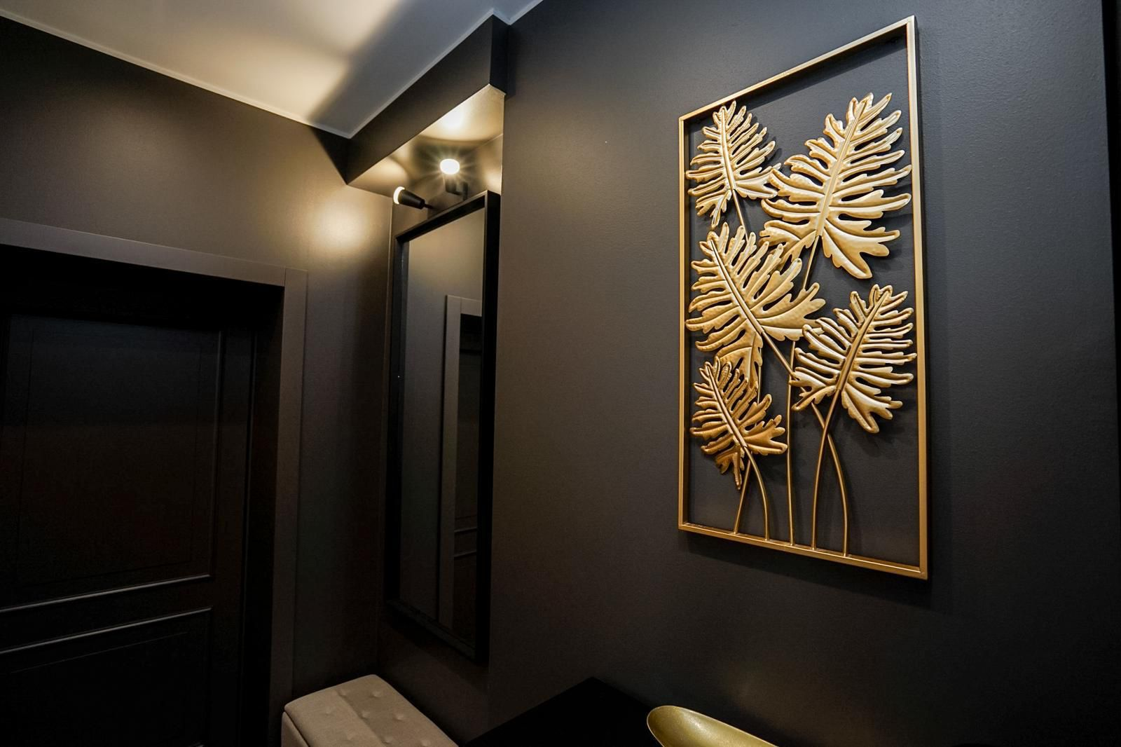 Elegant hallway with gold leaf botanical art
