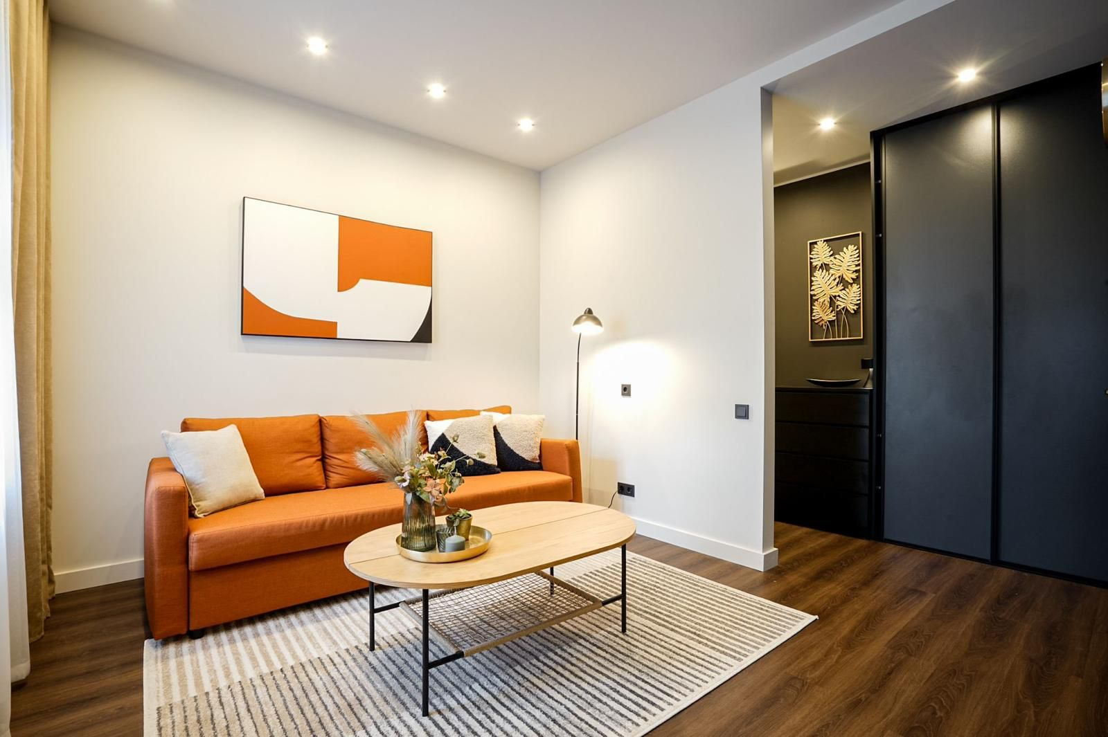 Living room with orange sofa and modern decor